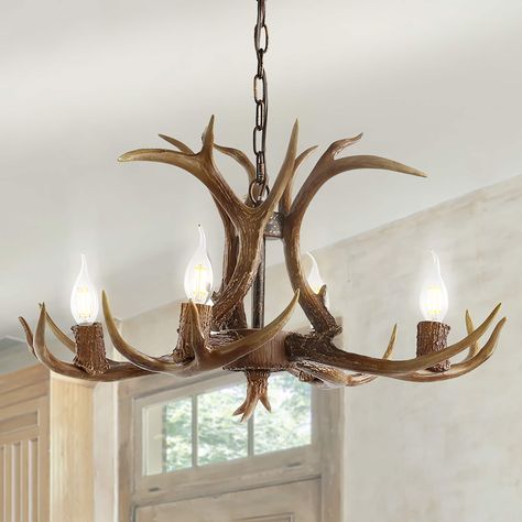 This faux antler chandelier transports us to our dream mountain home, bringing nature inside with a contemporary rustic touch. Featuring an adjustable metal pull, it can be adjusted to your ceiling height for a semi-custom look. Each unique finish brings a refreshing quality to this beautiful piece. JONATHAN Y Eldora French country/cottage Rustic 4-Light Brown Farmhouse Antler Chandelier | JYL6301A Bear Chandelier, Brown Farmhouse, Chandelier Rustic, Antler Lights, Antler Chandelier, Classic Chandelier, Wagon Wheel Chandelier, Rustic Contemporary, Rustic Chandelier