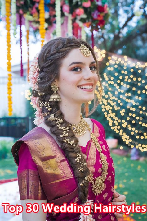 Discover the charm of elegant South Indian wedding hairstyles that are sure to turn heads on your special day. This stunning hairdo, featuring intricate braids adorned with fresh jasmine flowers, embodies the rich cultural heritage and beauty of South Indian traditions. Perfect for brides who wish to blend tradition with modern elegance, this hairstyle radiates grace and sophistication. Explore the endless possibilities for your wedding hairstyles! #weddinghairstyles #SouthIndianHairstyles Indian Hair Wedding, Braided Hairstyles For Bride Indian, South Indian Wedding Hairstyle, Hairstyle For Bride Indian, South Indian Wedding Hairstyles Braids, Indian Traditional Hairstyles, Bridal Hair Indian, Bridal Hairstyles Indian Weddings, Indian Bridal Hairstyles Wedding