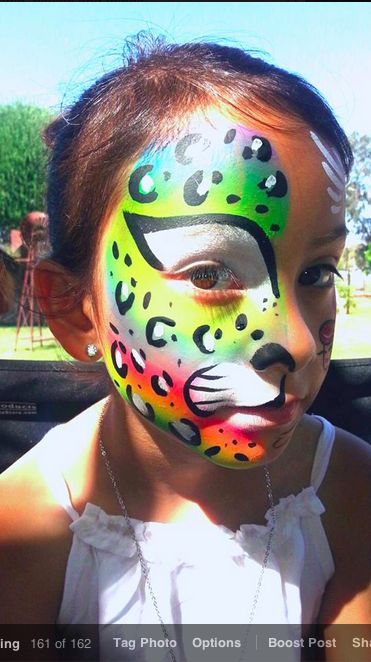 Rainbow leopard half mask. Face paintting by Glitter Goose! Cheetah cat print paint painter. Rainbow Leopard Face Paint, Rainbow Cheetah Face Paint, Cheetah Face Paint, Leopard Face Paint, Glow Painting, Cats Costume, Rainbow Face Paint, Cat Costume Kids, Glitter Face Paint