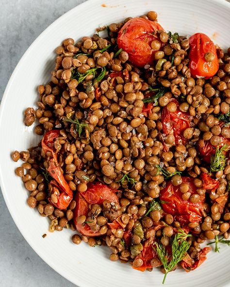 Lentils and tomatoes roasted with fresh minced garlic and olive oil and mixed with good quality balsamic vinegar and fresh herbs. This dish is delicious, easy to make, only uses 8 ingredients and can be made in less than an hour. Roasted Lentils, Tomato Lentils, French Lentils, Lentil Dishes, Sauteed Spinach, Green Lentils, Lentil Recipes, Roasted Sweet Potatoes, Side Salad