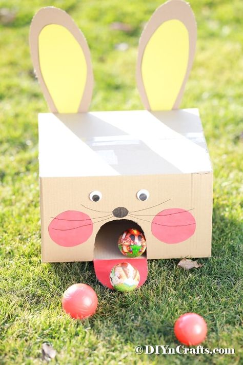 Turn an ordinary cardboard box into this adorable Easter bunny cardboard box ball game in just a few minutes! An ideal family-friendly Easter game DIY. #EasterBallToss #EasterBallGame #EasterGame #DIYBallToss #DIYEasterBunnyGame Bunny Cardboard, Easter Outdoor Games, Fun Easter Games, Easter Games For Kids, Easter Outdoor, Easter Festival, Easter Games, Toddler Easter, Easter Traditions