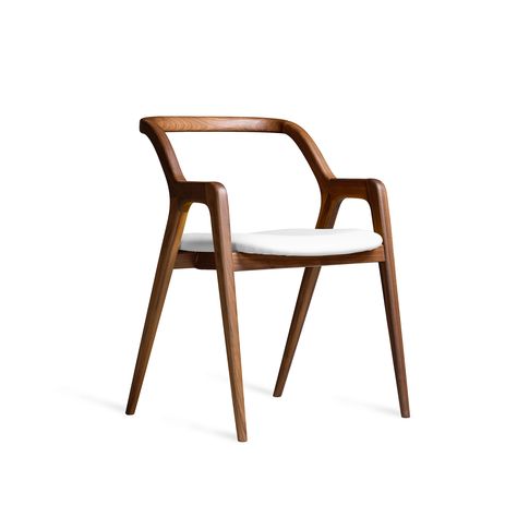 A solid wood chair with a refined Italian design, synthesis of craftsmanship, passion and attention to details. The walnut wood is hand-worked with extreme care and it feels almost soft to the touch thanks to the curved lines of the structure. Customizable lining in top quality leather or fabric and in different colors. Walnut Wood Chair, Wood Chair Design, Walnut Chair, Solid Wood Chairs, Artisan Furniture, Elegant Chair, Indoor Chairs, Modern Lounge Chairs, Curved Lines