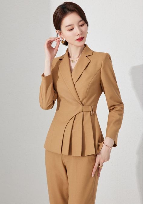 Introducing our Camel Chic Belted Blazer Set. Meticulously tailored to enhance your silhouette, it brings a fresh perspective to power dressing. The single-breasted blazer features a cinched waist and a playful peplum flare, while the smart belt detail adds a modern twist to the classic piece. Paired with comfortable yet stylish straight-leg trousers, this camel-colored ensemble is perfect for any occasion. Peak lapels; double-breasted pantsuit V-neck, Long sleeves; button cuffs. Structured shou Blazers Jacket For Women, Ladies Blazer Design, Model Atasan Batik, Power Suits For Women, Model Blazer, Stylish Blazer, Ladies Blazer, Blazer Jackets For Women, Fresh Perspective