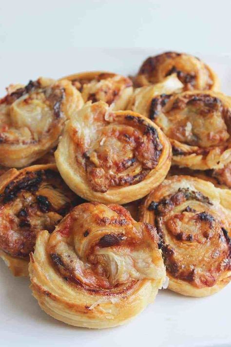 These Bacon & Cheese Pinwheels are made with puff pastry and are quick and easy to make for snacks, game days and party food. Puff Pastry Pinwheels | Puff Pastry Snacks | Bacon Pinwheels | Cheese Pinwheels | Quick Snacks | Easy Recipe | Feed a Crowd Quick And Easy Party Food, Bacon Cheese Puffs, Puff Pastry Bacon, Savoury Party Food, Puff Pastry Snacks, Pastry Pinwheels, Sweet Puff Pastry, Puff Pastry Pinwheels, Savory Puff Pastry