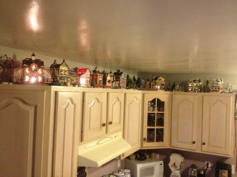 Christmas Village on top of cabinets - Steven Costa - 2013 Top Of Kitchen Cabinet Decor Modern, Decor On Top Of Kitchen Cabinets, Kitchen Cabinet Christmas Decor, Cabinet Christmas Decor, Bar Christmas Decor, On Top Of Kitchen Cabinets, Kitchen Cabinets Shelves, Decorating Above Kitchen Cabinets Ideas, Decor Above Kitchen Cabinets