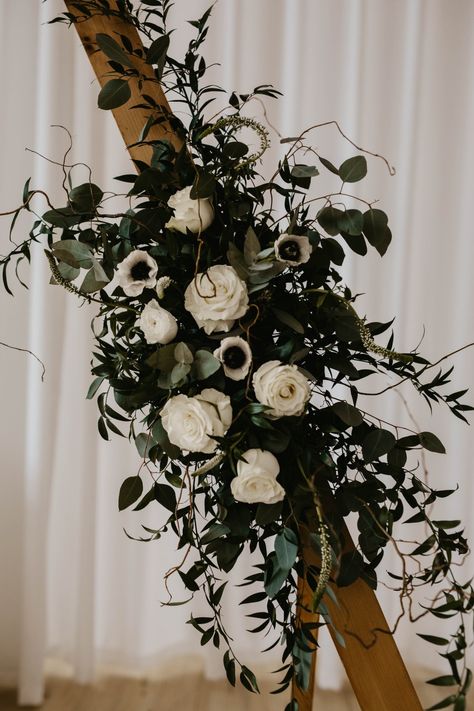 Flowers on triangle arbor Green And White Arbor Flowers, Triangle Arbor With Flowers, Black And Green Wedding Flowers, Black And Green Wedding Aesthetic, Dark Botanical Wedding, Dark Wedding Arch, Black Wedding Arch, Black And Green Flowers, Triangle Arbor