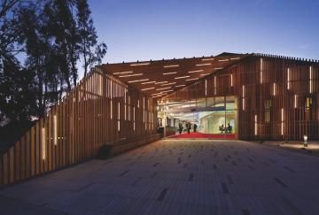 For a project at Claremont University Consortium, Claremont, N.Y., architect LTL and lighting designer Lumen Architecture used lighting to transform a steel-framed warehouse. An exterior slatted wooden screen is interspersed with LED strips, creating a striking nighttime effect. Photo: Michael Moran / Courtesy Lumen Architecture Ltl Architects, Ikea Canopy, Window Canopy, Canopy Architecture, Wooden Canopy, Canopy Curtains, Canopy Bedroom, Backyard Canopy, Wedding Canopy