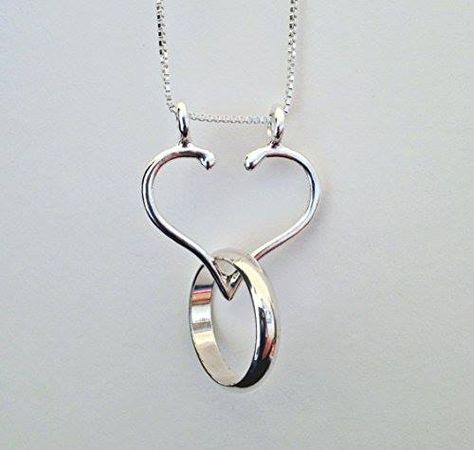 Shop https://goo.gl/M3wicw   Ring and Charm Holder Necklace Made In The USA Smooth Open Heart by Ali C Art approx. 1" x 1" Unique Handmade Sterling Silver Jewelry    Price 84.00   Go to Store https://goo.gl/M3wicw  #1 #Ali #Approx #Art #Charm #Handmade #Heart #Holder #Jewelry #Necklace #Open #Ring #Silver #Smooth #Sterling #Unique #USA Wedding Band Necklaces, Ring Holder Elegant, Couple Ring Necklaces, Wedding Ring Necklaces Silver, Necklaces With Ring Pendant, Cheap Ring Holder, Necklace Ring Holder Men, Chain Necklace To Hold Ring, Ring Holder Christmas