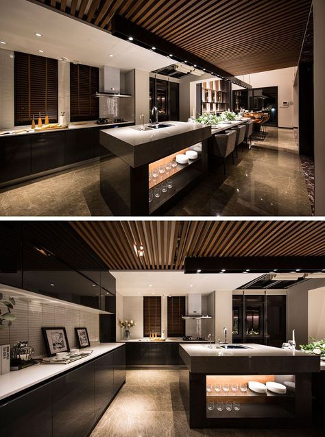 This long and modern kitchen island is home to a bar, a six person dining table and a food prep area. #KitchenIsland #ModernKitchen Long Narrow Kitchen Layout, Narrow Kitchen Layout, Kitchen Luxury Design, Dapur Rustic, Long Narrow Kitchen, Popular Kitchen Colors, Kitchen With Long Island, Model Dapur, Interior Dapur