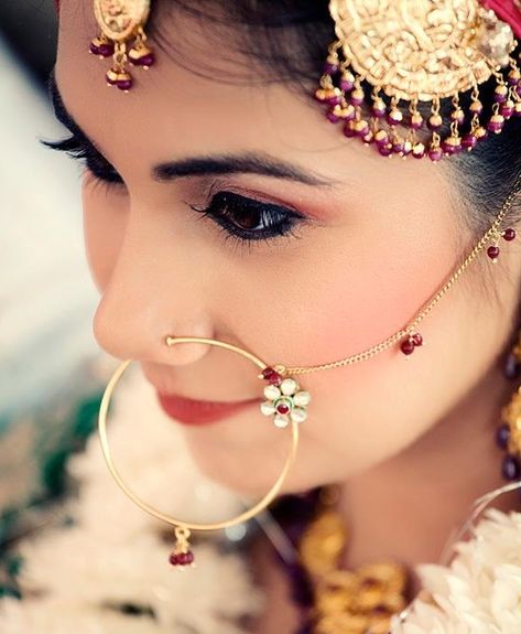 http://www.weddingsonline.in/blog/editors-pick-bridal-nose-ring-designs-we-love/ naath, jhoomar Simple Nath Nose Ring, Nose Ring Designs, Nath Nose Ring, Bridal Nose Ring, Nose Ring Jewelry, Indian Bridal Jewellery, Indian Nose Ring, Nose Jewelry, Indian Wedding Jewelry