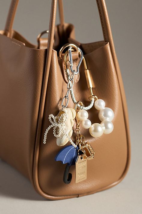 Charming new-trend alert: jewelry for your bag, featuring a thread-wrapped carabiner and pearl-decorated chain, perfect for stacking multiple charms. | Rope Carabiner Bag Charm by Anthropologie in Grey, Women's, Polyester/Brass/Resin Keychain For Bags, Mini Bag Design, Handbag Charms Aesthetic, Purse Jewelry Key Chains, Purses With Charms, Bags With Charms Aesthetic, Bags With Keychain, Bag Chain Charm, How To Make Bag Charms