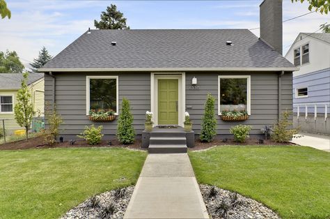 gray exterior, renovated mid-century bungalow-love things green door! Mid Century Bungalow, Small House Remodel, House Aesthetics, Ranch House Remodel, Gray House Exterior, House Green, Old Home Remodel, Green Exterior, Ranch Remodel