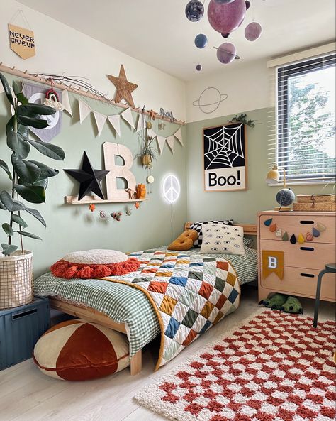 Muted boys room with textured bedding and Halloween wall print Cozy Kids Bed, Scandi Boys Bedroom, Retro Toddler Boy Room, Little Boy Room Colors, Red Toddler Room, Eclectic Boys Bedroom, Colorful Toddler Boy Room, Colourful Boys Bedroom, Green Little Boys Room