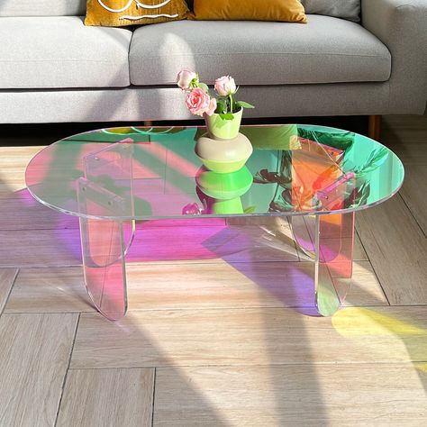 Add some clarity to your living room with Iridescent Acrylic Oval Clear Coffee Table. This table is the perfect addition to any home, bringing with it a clean, stylish feel and colorful rainbow that is sure to add some life to your living space. Iridescent Coffee Table, Iridescent Living Room Decor, Pastel Coffee Table, Iridescent Room Decor, Rainbow Room Aesthetic, Cute Living Room Decor, Funky Dining Room, Colorful Living Room Bright, Abstract Room Decor