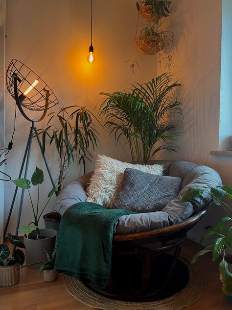 Wooden reading chair surrounded by plants and industrial lamp Chambre Inspo, Cozy Reading Corners, Viborg, Bedroom Corner, Dream Apartment Decor, Dream House Rooms, Cozy Room Decor, Apartment Decor Inspiration, Room With Plants