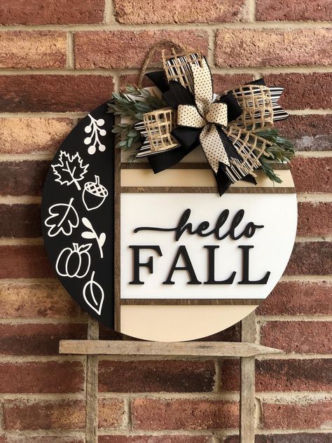 We offer a wide variety of wooden door hangers to spruce up your front door!  Description: Welcome the cozy vibes of autumn with our stunning Hello Fall Door Hanger, perfect for adding a touch of warmth and charm to your front door! Handcrafted with care, this door hanger is available in two sizes, 18" and 22", and features high-quality materials and craftsmanship. Product Features: Sizes: Choose between 18 inches and 22 inches in diameter. Thickness: Sturdy 1/2 inch thickness for durability. 3D Diy Fall Door Hangers, Fall Door Signs, Fall Wooden Door Hangers, Welcome Wood Sign, Round Signs, Fall Door Hanger, 3d Lettering, Door Signs Diy, Circuit Ideas