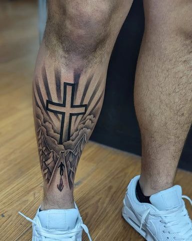 Cross Tattoo Designs for Men Tattoo Cross Men, Tattoos For Men On Leg, Faith Tattoo Men, Cross Tattoo Designs For Men, Cross Tattoos For Men, Unique Cross Tattoos, Tattoo Cross, Symbols Of Faith, Cross Tattoo For Men