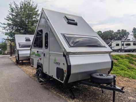 You may get lots of head turns with an A-frame camper, and for good reasons. They're cute, trendy, and efficient. So what is an A-frame RV? Let's find out! Are A-Frame Campers Any Good? See the 7 Best A-Frame Campers of 2021 #rvlife #rvliving #rvlifestyle #aframecamper #aframerv #aframepopupcamper Aliner Campers, A Frame Camper, Lightweight Campers, Folding Campers, Rv Gear, Small Travel Trailers, Small Trailer, Tent Trailer, Small Campers