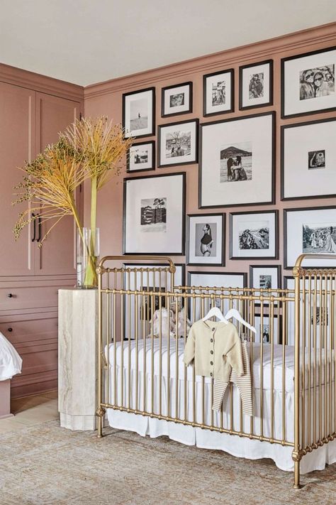 PHOTO: Shay Mitchell's Los Angeles home appears in Architectural Digest. Shay Mitchell Nursery, Nursery Brass Crib, Brass Crib Nursery, Black White And Gold Nursery, Nursery Picture Wall, Brass Crib, Wall Of Paintings, Nyc Nursery, Wall Of Pictures