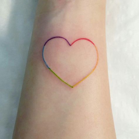 My first ever tattoo! Pride color heart on my right wrist. Done by Carly at Indigi-Ink in South Australia! #tattoo #firsttattoo #indigi-ink #loveislove #lgbtpride #loveheart Colour Heart Tattoo, Pride Heart Tattoo, Rainbow Outline Tattoo, They Them Tattoo, Love Is Love Tattoo Pride, Yellow Heart Tattoo, Heart Tattoo Color, Pride Tattoo Ideas, Rainbow Heart Tattoo