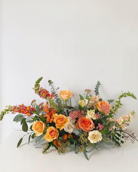 Orange Fall Centerpieces, Low Profile Floral Centerpieces, Orange Flower Table Arrangements, Horizontal Floral Design, Large Flower Centerpieces Wedding, Low Table Arrangements, Low Centerpieces Wedding Long Table, Parallel Floral Arrangement, Orange And Green Floral Arrangements