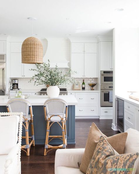 Gorgeous white kitchen with a blue island, basket pendant lights, Serena & Lily barstools, and olive branches for greenery. #home #homedecor #kitchendecor Serena And Lily Kitchen, Gorgeous White Kitchen, Basket Light, Basket Pendant, Olive Leaves, Olive Branches, Bistro Style, Serena Lily, Bright Kitchens