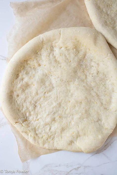 Cornmeal pizza crust on a parchment paper. Cornmeal Pizza Crust, Quick Pizza Crust, Cornmeal Crust, Midwest Kitchen, Cornmeal Recipes, School Pizza, Homemade Pizza Crust, Skillet Pizza, Quick Pizza