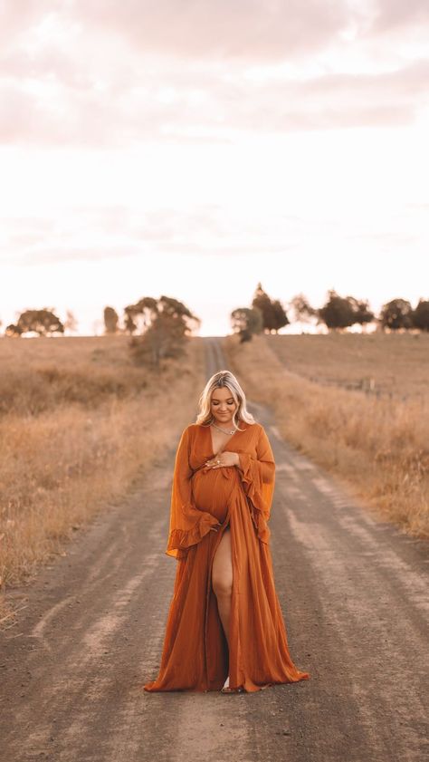 Congratulations @courtneeybyrnee on the safe arrival of your baby boy 💛✨ #stopgomotion #maternityshoot #maternity #goldenhour… | Instagram Formal Dress Maternity Photos, Western Maternity Dresses For Photoshoot, Rust Dress Maternity Shoot, Dirt Road Maternity Photoshoot, Save The Date Photoshoot Outfits, Western Outfit Maternity, Western Fall Maternity Pictures, Orange Maternity Photoshoot, Dirt Road Maternity Pictures