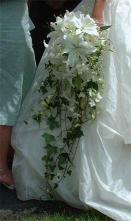 cascading bouquet. Holding A Bouquet, Cascading Bouquet, Cascading Bridal Bouquets, Cascading Wedding Bouquets, Lily Wedding, Lily Bouquet, Boquette Flowers, Cascade Bouquet, Dream Wedding Ideas Dresses