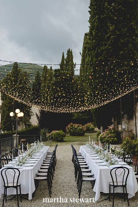 The beauty of string lights is that they aren't too heavy and can be strung nearly anywhere. Take this lovely al fresco dinner, where Italian Eye and GB Audio used a few poles with bases to install twinkling strands. What that means is they can go over any part of your ceremony, cocktail hour, or reception. #weddingideas #wedding #marthstewartwedding #weddingplanning #weddingchecklist Wedding Table Planner, Country Wedding Reception, Wedding Reception Hall, Wedding Reception Lighting, Wedding Hairstyles Tutorial, Rustic Wedding Reception, Outdoor Wedding Inspiration, Martha Stewart Weddings, Rustic Country Wedding