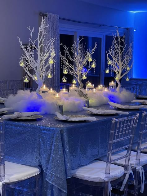 Quince Wonderland Theme, Sweet 16 Decorations Winter Wonderland, Silver Winter Wonderland Party, Winter Birthday Party Centerpieces, Winter Wonderland Entrance Ideas, Pink And Blue Winter Wonderland Party, Winter Wonderland Dress Sweet 16, Sweet 16 Blue Theme Winter Wonderland, Winter Wonderland Aesthetic Party