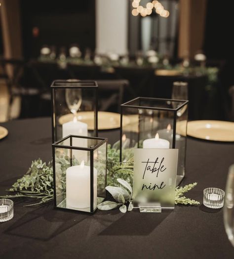 Edgy Wedding Centerpieces, Black Candle Table Decor, Black White And Green Centerpieces, Dark Wedding Centerpieces Diy, Black And White Wedding Reception Decor, Candle Centerpieces Wedding Round Table, Black Candle Centerpieces, White Candles Centerpiece, Black Wedding Theme