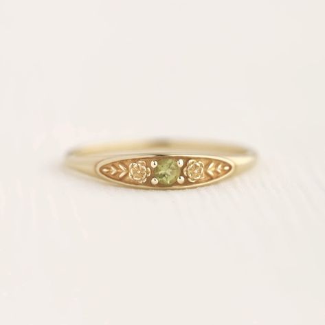 August birth ring This ring will be a very meaningful piece for those born in August . August's birthstone and birth flower are Peridot and Poppy. Greeny peridot and delicately carved poppy will shine and bloom forever. This dainty and slim signet ring is comfortable to wear all the time. This piece will be perfect gift for both to others and yourself. * Detail * Material : 14K solid gold, 18K solid gold, 925 sterling silver Color : Yellow gold, White gold or Rose gold(925 sterling silver is exc September Birth Stone Ring, August Birthstone Rings, Carved Silver Ring, Gold Floral Ring, Engagement Rings Embedded Stone, Peridot Signet Ring, Vintage Stone Ring, Vibtage Rings, Solid Gold Rings Unique