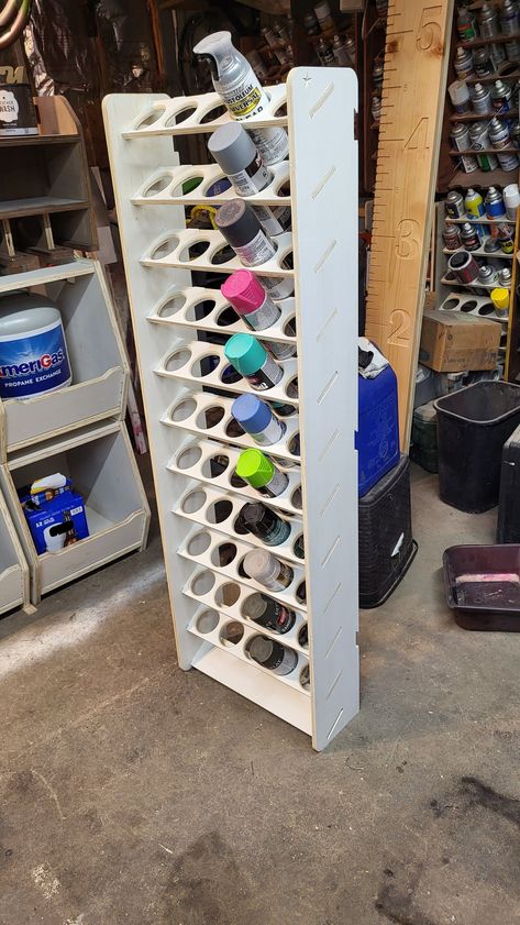 "This is a DIY wall mounted or free standing rattle can organizer. It is ready to assemble and finish. All parts have been sanded and fit checked.  Saves time looking for the spray can you need. Makes the area a lot neater. I can custom make them different sizes with different size/shapes of shelf holes. I can finish them as you like or send them unfinished. These are cut from 1/2\" plywood. I now include an 20 inch wall mounting cleat. Please note; The price of lumber and shipping boxes has inc Spray Can Storage, Spray Paint Storage, Garage Workshop Organization, Garage Organization Diy, Tool Storage Diy, Wooden Pallet Furniture, Horseshoe Crafts, Paint Storage, Can Storage