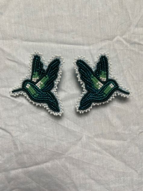 Native beadwork hummingbird earrings Hummingbird Earrings Beaded, Beadwork Projects, Caribou Tufting, Fancy Shawl Regalia, Hummingbird Wings, Fancy Shawl, Blue Hummingbird, Jingle Dress, Beadwork Ideas