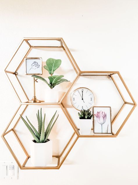 Cost Plus World Market hexagon shelves look great in the bathroom and the warm brass looks great with the modern lines. #modernfarmhouse #costplusworldmarket #brassshelf #openshelves #hexagonshelves #bathroomshelves Gold Hexagon Shelves, Honeycomb Shelves Bathroom, White Hexagon Shelves, Gold Honeycomb Shelves, Hexagon Shelves Gold, Octagon Shelves Decor, Hexagon Shelves Bathroom, Gold Shelves Bedroom, Hexagon Shelf Decor