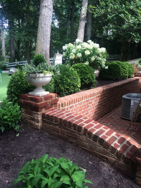 Short Brick Retaining Wall, Brick Retention Wall, Red Brick Retaining Wall Garden, Brick Patio With Retaining Wall, Red Brick Retaining Wall Ideas, Brick Retaining Wall Ideas Hillside, Brick Wall Front Yard, Short Brick Wall In Front Of House, Brick Knee Wall Patio