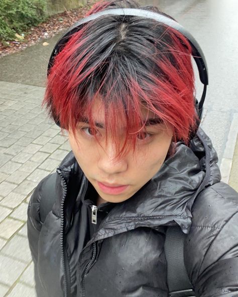 asian handsome model with red hair in the raib wearing a ouffer jacket Black Hair Red Tips, Boys Dyed Hair, Pelo Color Borgoña, Black Hair With Red Highlights, Red Hair Tips, Red Hair Boy, Boys Colored Hair, Fade Hairstyle, Short Dyed Hair