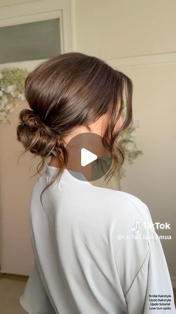 Kristina Youssef - K Y K ® on Instagram: "California stylist @rachel.luskhmua shares how to create a stunning textured clean bun using cult favourite @kykhaircare Magic dust volume powder.   Use the powder to add volume at the crown before back combing, and use it to add texture and fullness before pinching on the hair.  Add it from roots to ends to create the perfect texture in your fringe for facial framing." Hair Bun Low Tutorial, Easy Low Bun For Wedding Guest, Modern Low Bun Wedding, Evening Hair Updos, Higher Updos, Bun With Loose Strands, Low Bun Covering Ears, Loose Low Bun Wedding Hair Front View, Low Bun For Shoulder Length Hair