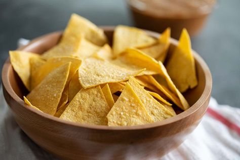 Crispy and salty, these Homemade Tortilla Chips are so easy to make and so much better for you than store bought. They are the perfect afternoon snack. #recipe #homemade #tortillachips #snack Chip Aesthetic, Queso Blanco Recipe, Chips And Queso, Cheese Dip Mexican, Tortilla Chip Recipe, Baked Tortilla Chips, Homemade Tortilla, Tortilla Chip, Fried Chips