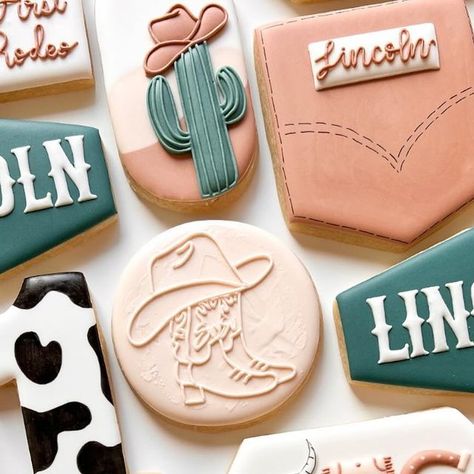 A Lil Something Sweet Custom Cookies on Instagram: "Yeehaww it’s Lincoln’s 1st Rodeo!! 🤠  Balloon arch template from @maddiescookieco  • • • #bake #baker #cookies #cookie #cookier #cookiesofinstagram #cookiedecorating #cookieart #cookielettering #cowboycookies #firstbirthday #firstbirthdaycookies #1stbirthdaycookies #birthdaycookies #rodeocookies #firstrodeocookies #cactuscookies #cowcookies #sugarcookies #sugarcookiesofinstagram #sugarcookie #sugarcookiedecorating #sugarcookiesdecorating #sugarcookieart #royalicing #royalicingcookies #designercookies #customcookie #customcookies #alilsmthsweetcookies" Texas Themed Cookies Decorated, Texas Cookies Decorated, Rodeo Balloon Arch, Cowgirl Cookies Decorated, Western Sugar Cookies, Rodeo Cookies, Arch Template, Country Cookies, Western Cookies