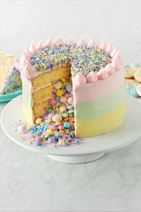 This is the ultimate "wow" cake to bring out at your Easter party or any occasion that calls for a second-to-none impressive dessert. The base of the cake is using Betty Crocker™ Super Moist™ Yellow Cake Mix. Fill the center of the cake with candies and sprinkle mix for a colorful surprise that spills out of the cake when it's cut. Ombre frosting is made more achievable with Betty Crocker™ Rich & Creamy Vanilla Frosting tinted with pastel gel food colors. Surprise Inside Cake, Impressive Dessert, Betty Crocker Cake, Inside Cake, Impressive Desserts, Layer Cake Recipes, Cake Stuff, Easter Cake, Cupcake Decorating