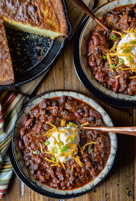 The complexity of flavors in this Beef Short Rib Chili make it the ultimate comfort food. Dried Ancho and California chile peppers are the keys to its depth and intensity. Chocolate and Coffee, the secret ingredients, add to its richness. Top it off with tender chunks of meat that just about melt in your mouth. #beefchili #shortribchili #onepotmeals #beefshortribs #comfortfood Rib Chili Recipe, Short Ribs Chili Recipe, Short Rib Chili, Chili Contest, Chili Dinner, Chile Peppers, Chocolate And Coffee, Sweet Cornbread, Chilli Recipes