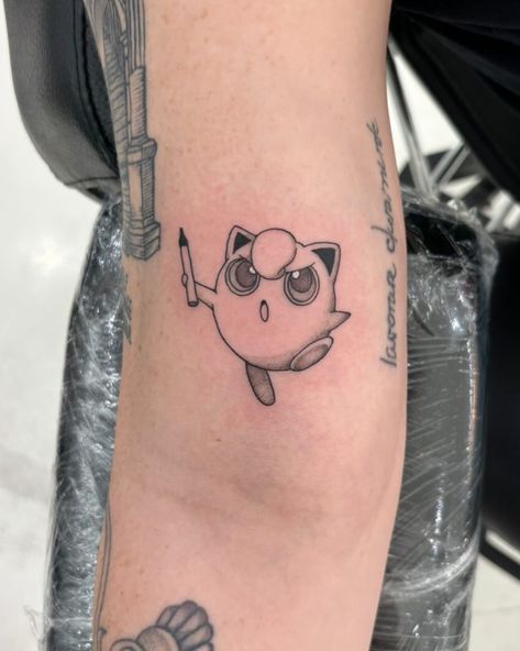 Caught the cutest Pokémon, Jigglypuff! 😻  Tatted by @echo.inkz  Soho, Union Square, and Williamsburg  11AM-9PM 7 DAYS A/W🕘 WALK-INZ OR BOOK ONLINE..📕 TATTOOS & PIERCINGS, NO ATTITUDE, NO MISERABLE HOOPS TO JUMP THROUGH....🚫  WALK-INZ WELCOME OR BOOK ONLINE AT  ⚔️livebytheswordtattoo.com⚔️ . . . . #pokemon #pokemontattoo #jigglypuff #tattooartist #nyctattoo #soho #manhattan Jigglypuff Tattoo, Soho Manhattan, Pokemon Jigglypuff, Nyc Tattoo, Pokemon Tattoo, Time Tattoos, Union Square, Cute Pokemon, Tattoos And Piercings