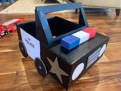 Cardboard Box Car With Straps, Card Board Box Car Diy, Police Car Out Of Cardboard, Transportation Cardboard Boxes, Cardboard Police Car Diy, Police Car Costume Cardboard Boxes, Cardboard Box Transportation Ideas, Cars Out Of Cardboard Boxes, Police Cardboard Box Car