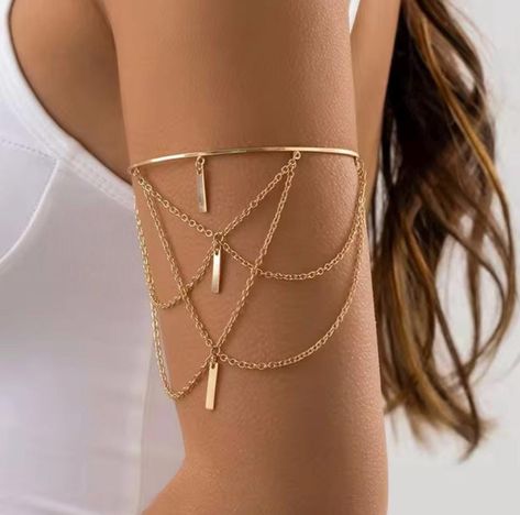 Statement Upper Arm Bracelet  Make a bold statement with this elegant gold arm cuff, featuring layered chains and geometric bar pendants. Perfect for adding a touch of glamour to any outfit, this arm bracelet wraps comfortably around your upper arm, creating a chic and modern look. Whether you're dressing up for a special occasion or elevating your everyday style, this cuff is the ideal accessory for any fashion-forward individual. Lightweight and adjustable, it ensures a comfortable fit while m Arm Bands Jewellery, Arm Cuffs Jewelry, Upper Arm Bracelets, Arm Band Jewelry, Arm Cuff Jewelry, Bar Pendants, Gold Arm Cuff, Upper Arm Bracelet, Project School