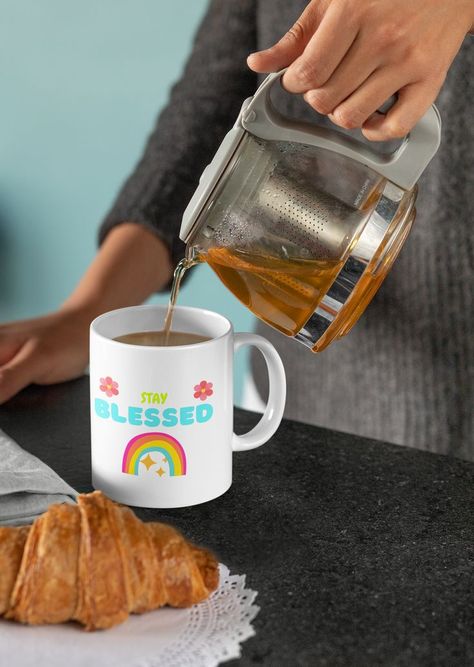 Coffee, tea, or art? Have it all with this eye-opening ceramic mug. A cute, light-colored 'STAY BLESSED' designed mug to radiate positivity this summer. Never Stop Dreaming, Customised Mugs, Tea Drinkers, Cup Of Joe, Fun Cup, Ceramic Mugs, Gifts In A Mug, How Many, White Ceramics