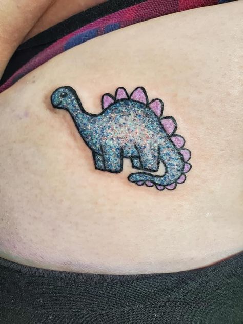 #glittertattoo #glitter #dinotatto #tattoo #tattooideas Colorful Glitter Tattoo, Real Glitter Tattoo Ideas, Glitter Ghost Tattoo, Glow Worm Tattoo, Small Glitter Tattoo, Glitter Style Tattoo, Glitter Tattoos Real, Glitter Tattoo Permanent, Baby Dinosaur Tattoo