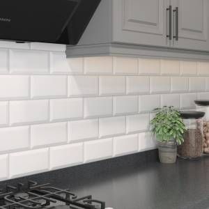 Wall Tiles | Ceramic, Porcelain & Vinyl | Homebase Back Splashback Kitchen Ideas, Splashback Kitchen Ideas, Metro Tiles Kitchen, White Kitchen Wall Tiles, Bevelled Tiles, Kitchen Splash Back, White Gloss Kitchen, Kitchen Splashback Tiles, Beveled Subway Tile