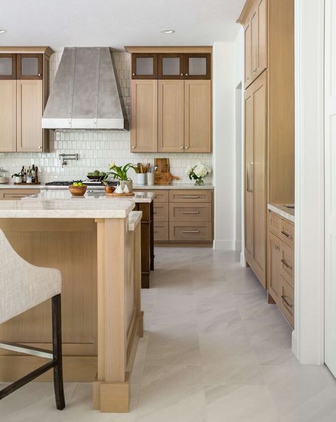 BEFORE AND AFTER KITCHEN REMODEL - The light porcelain tile floor will be really durable for this client. Keeping the majority of the wood cabinets light toned made for a crisp but earthy look. Carla Aston, Designer | Colleen Scott, Photographer Kitchen White Tile Floor, Old Oak Cabinets, Porcelain Tile Floor Kitchen, Light Wood Kitchen Cabinets, Carla Aston, Light Oak Cabinets, Lids Storage, Light Wood Kitchens, White Oak Kitchen